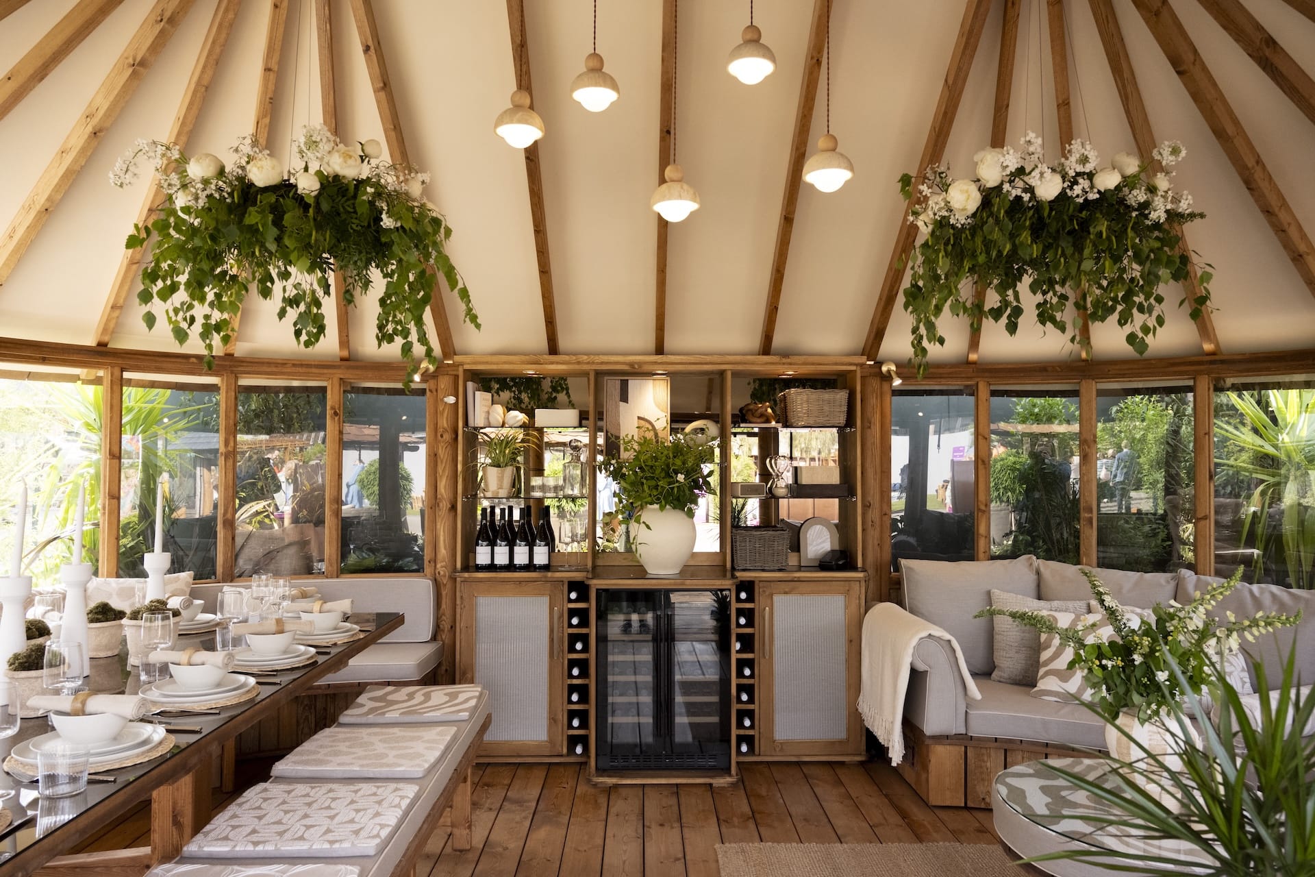 inside oval breeze house with wine cabinet and bar section